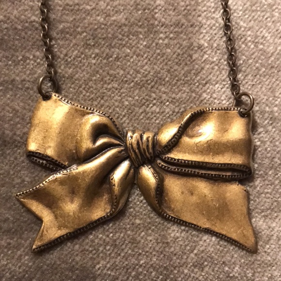 Beautiful Brass Toned Bow Necklace - Picture 2 of 3